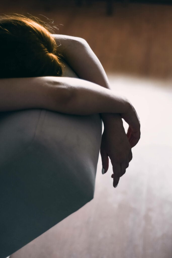 An image of a tired person laying down representing Dare 2 Share's blog titled 5 Common Youth Pastor Struggles and How to Combat Them