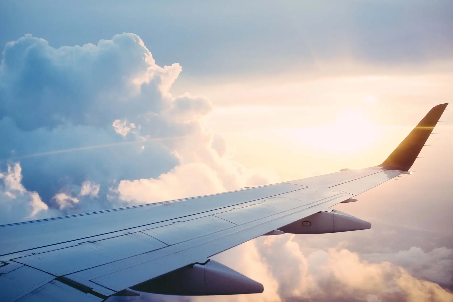 4 Surprisingly Simple Keys to Sharing the Gospel shown by a plane wing, because a gospel conversation is like an airplane