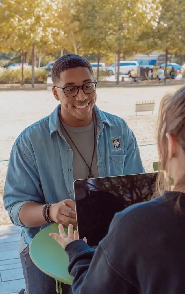 An image of a young man meeting with a student representing Dare 2 Share's blog titled 6 Essentials for Youth Leader Training. The goal is to help with youth ministry training.