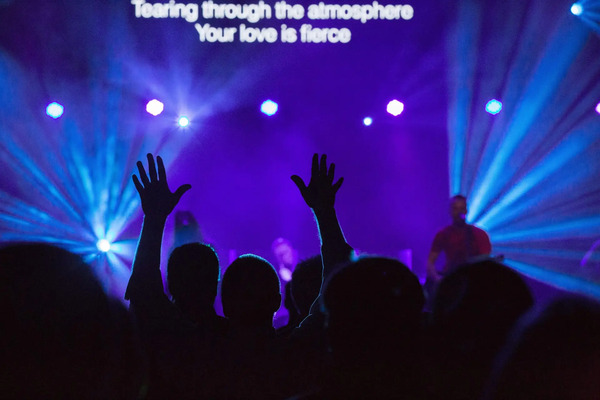 People lifting up their hands during a worship service