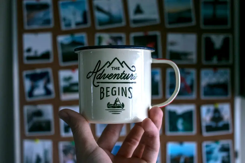 Mobilizing teenagers for a spiritual awakening. revival. dare 2 share live. image of a coffee mug being held by a hand.