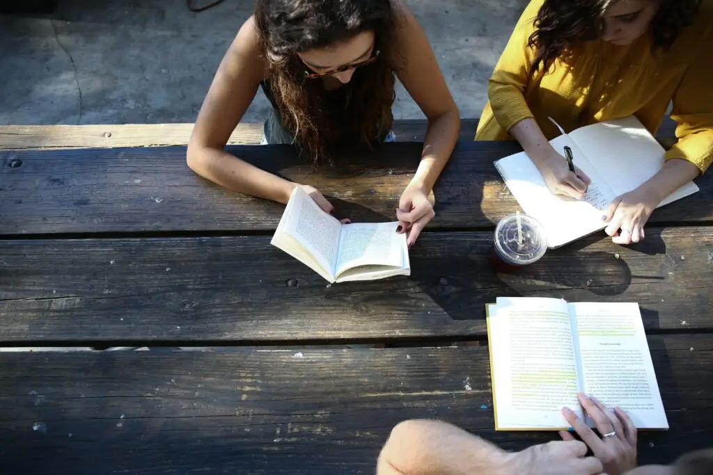 Teen girls studying the bible representing Dare 2 Share's blog titled 4 Steps to Make Every Youth Meeting Gospel-Focused and Evangelistic.