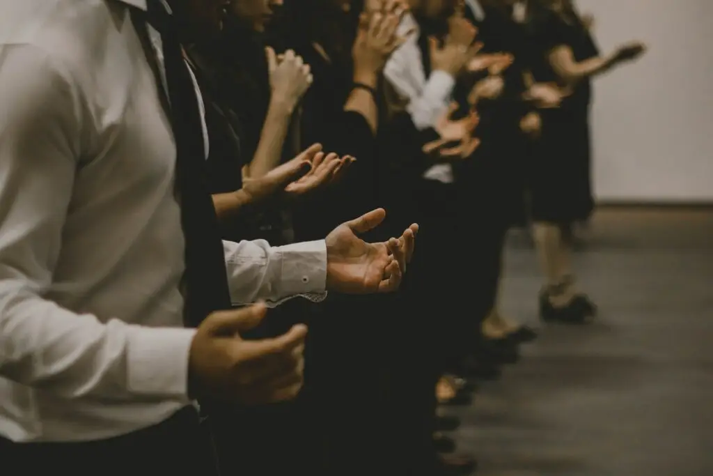 People in church praying, representing Dare 2 Share's blog on 4 ways to pray for a successful, evangelistic youth group.