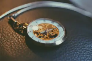 Picture of a gold and white pocket watch
