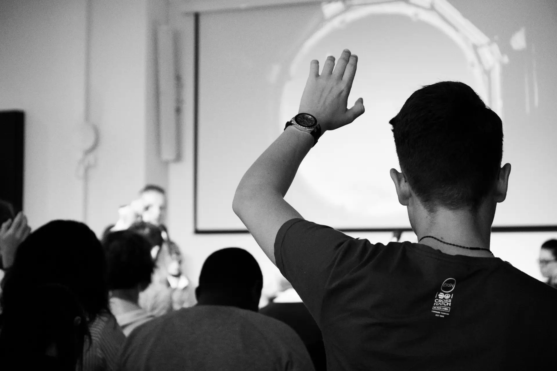 Guy holding up his hand during a training session