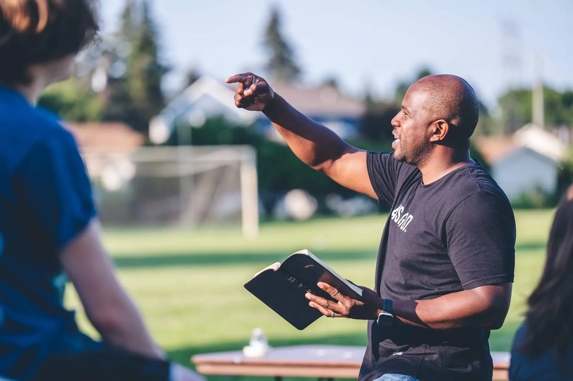 Image of a man preaching outside representing Dare 2 Share's blog titled How to Cast a Bold Vision for Your Youth Ministry: 5 Steps to Unlocking Its Potential