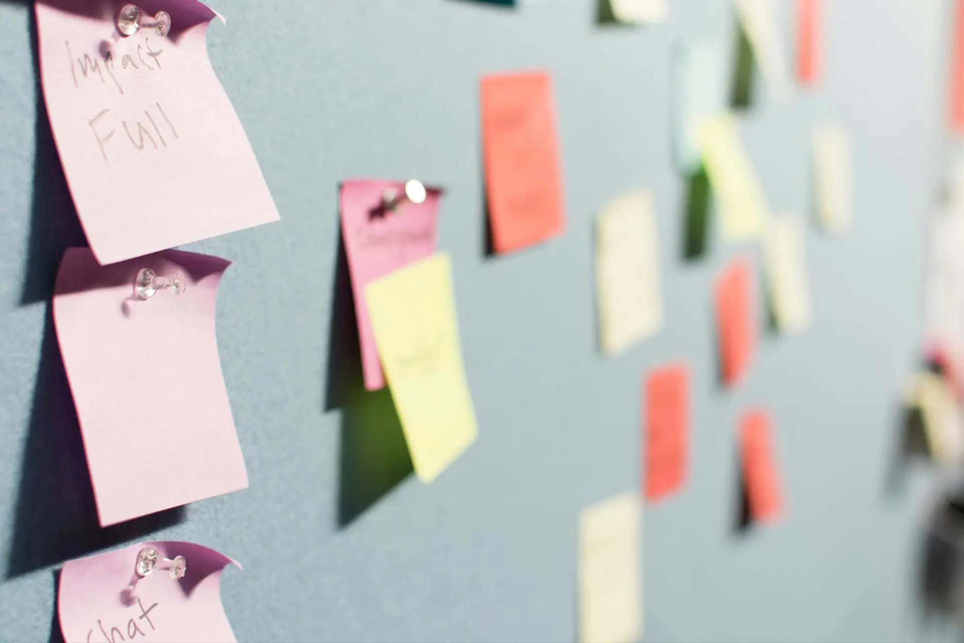 A wall of stickey notes to help you How to Gospelize Your Youth Event Calendar