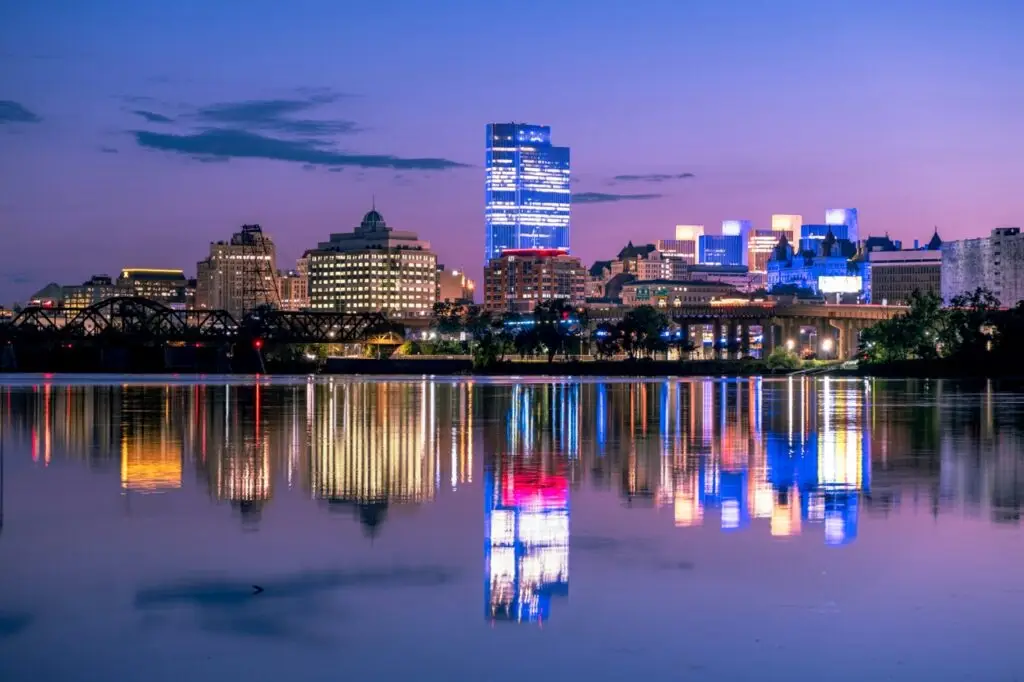 An image of downtown Albany at dusk. The image is used to represent the LTC Local event in Albany, NY. People in the North East are encouraged to join Lead THE Cause Local in Albany, NY.