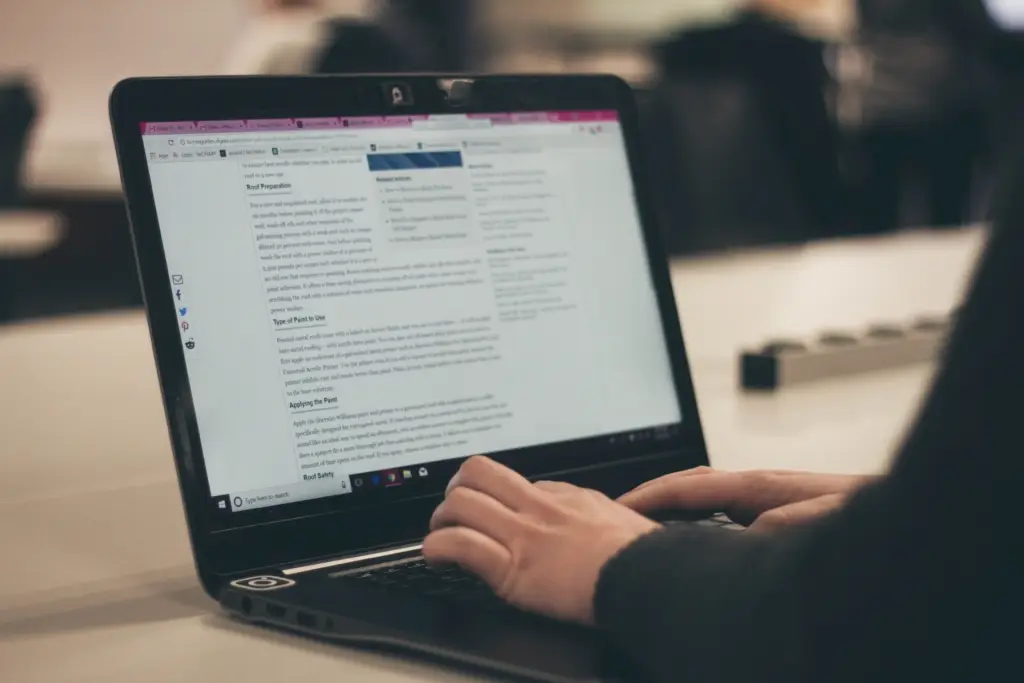 image of a teen using a computer representing youth ministry resources and youth group resources.
