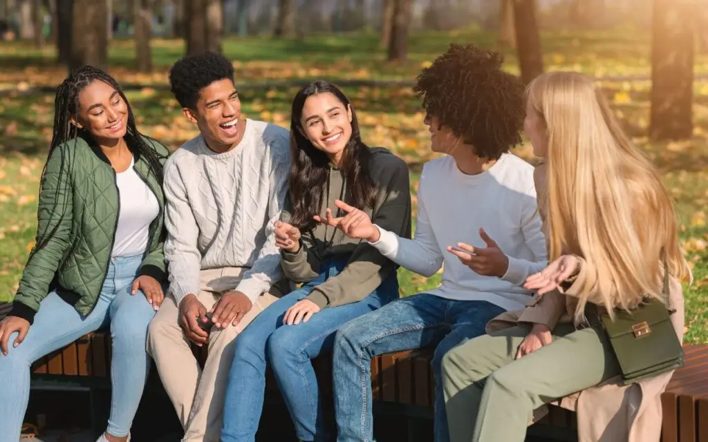 Image of an older teen sharing the gospel with her friends.