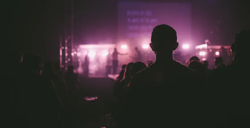 youth leave christianity. Image of people worshipping at a church gathering.